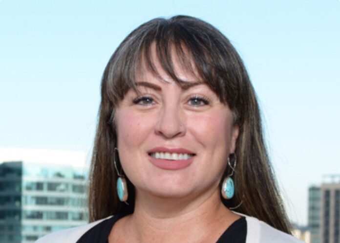 Lindsay Dofelmier smiles in a headshot photo.